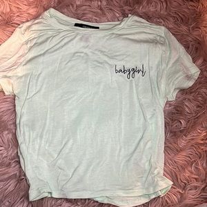 This is a beautiful light green very stretchy material crop top for teens